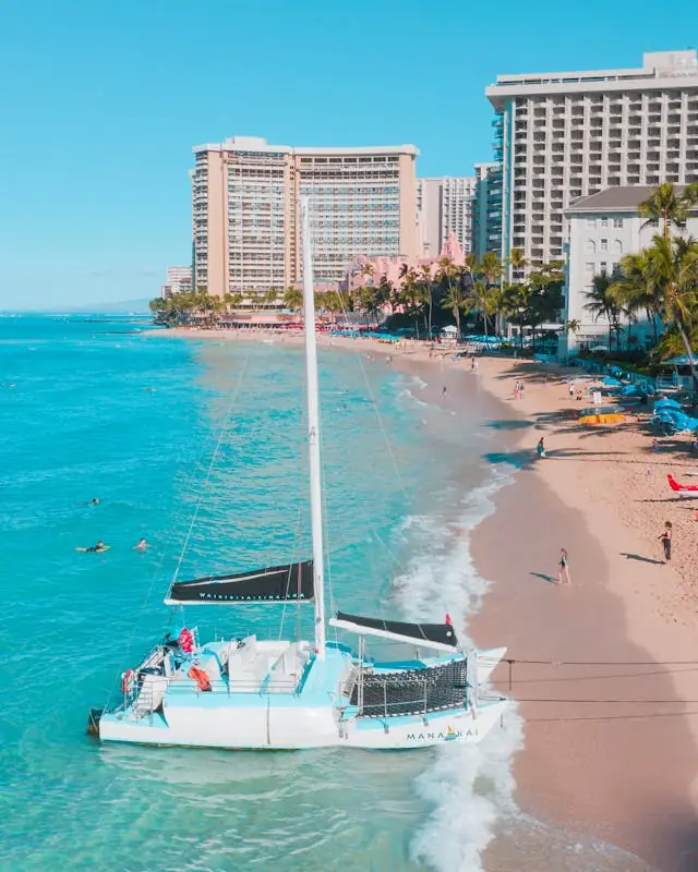 Catamaran boat near the shoreline at Waikīkī Beach in Honolulu, Hawaiʻi
