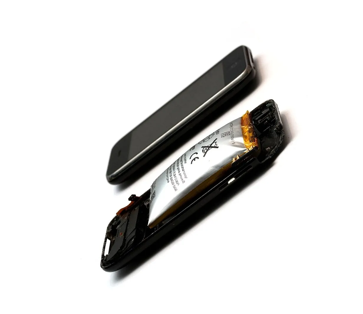 Damaged smartphone with expanded lithium-ion battery illustrating a dangerous product defect