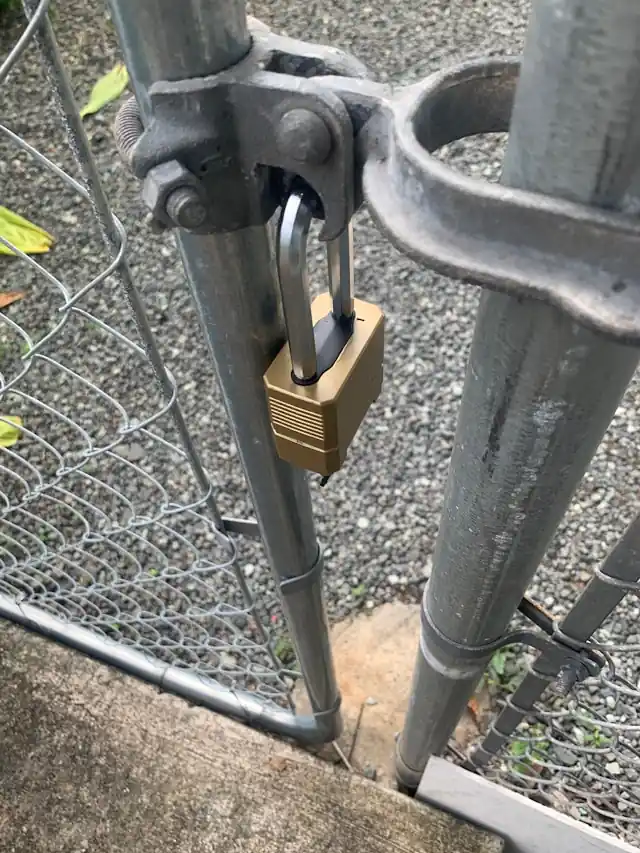 Metal gate with padlock